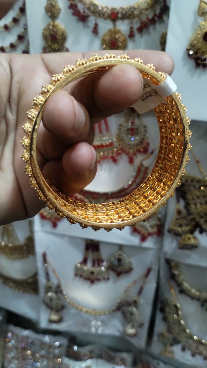 Golden Brass Bangles for Women â€“ 1 Pair Artificial Jewelry Bangles in Bright Gold Color for Daily Use, Festive Wear, and Party Styling